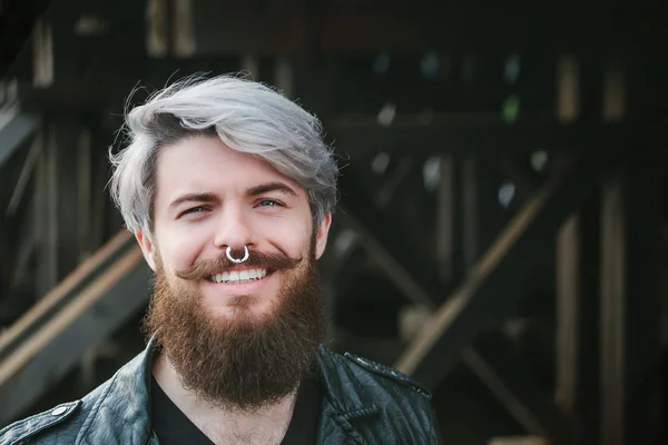 Bearded hipster with nose ring in leather jacket — Zdjęcie stockowe