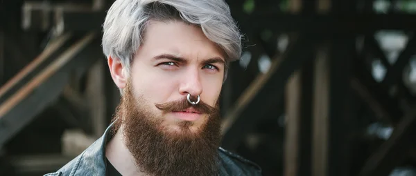 Bearded hipster with nose ring in leather jacket — Stock Photo, Image