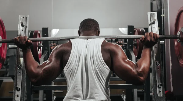 Weight training African doing bodybuilding — Stock Photo, Image