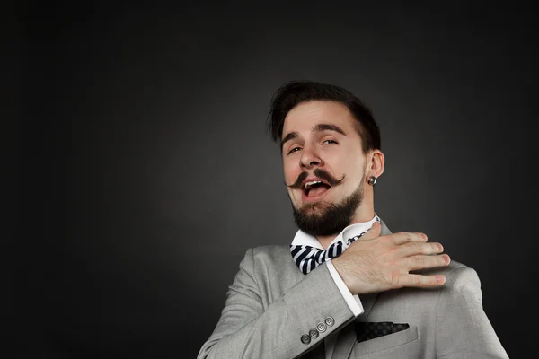 Handsome guy with beard and mustache in suit — Stock Photo, Image