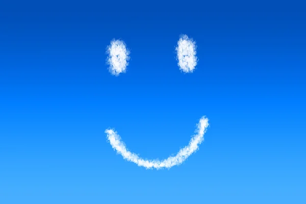 Smiley face shaped cloud in a bright blue sky — Stock Photo, Image