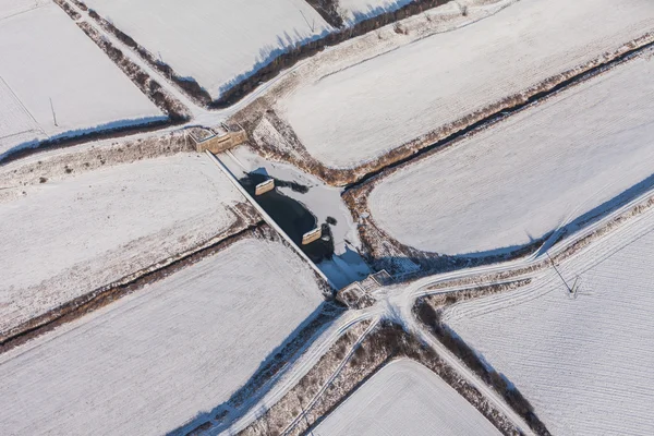 Skörden fält i vinter — Stockfoto