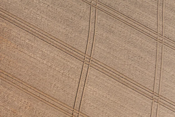 Tractor tracks on the harvest field — Stock Photo, Image