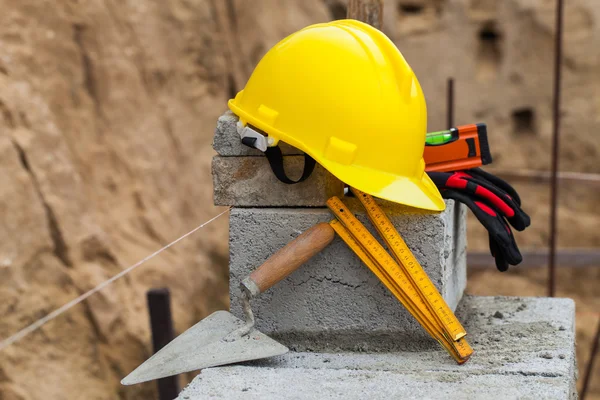 Helmet and buildings tools — Stock Photo, Image
