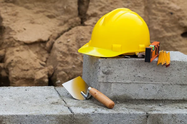 Helmet and buildings tools — Stock Photo, Image