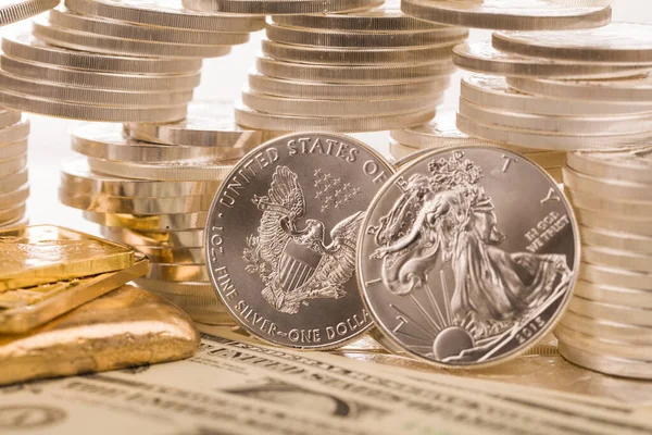 silver and gold bullion on the table