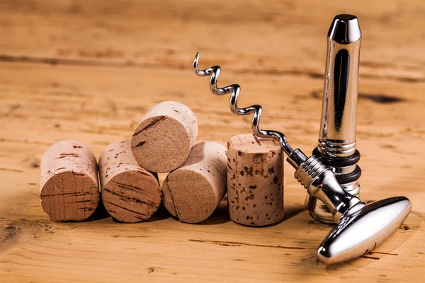 Wine corks and corkscrew on table — Stock Photo, Image