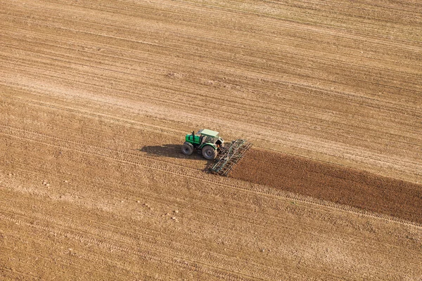 Harvest fields with tractor — Stock Photo, Image