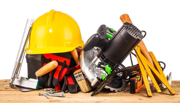 Helmet and wooden mounting tools — Stock Photo, Image