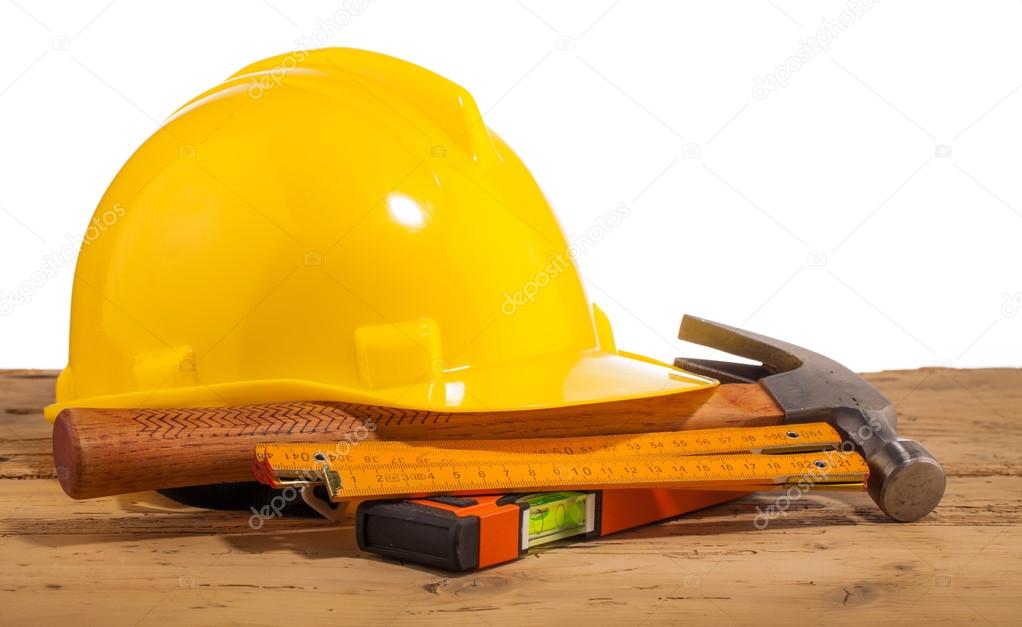 Yellow helmet and wood mounting tools