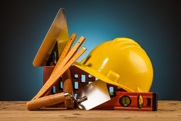 Yellow helmet and builder tools