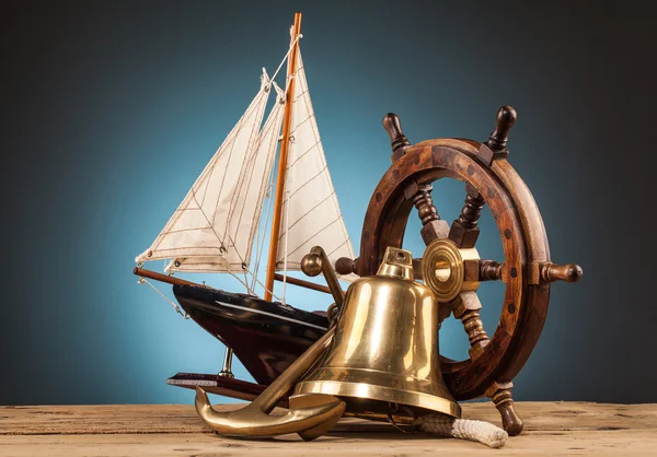 Telescope anchor and old wooden steering wheel