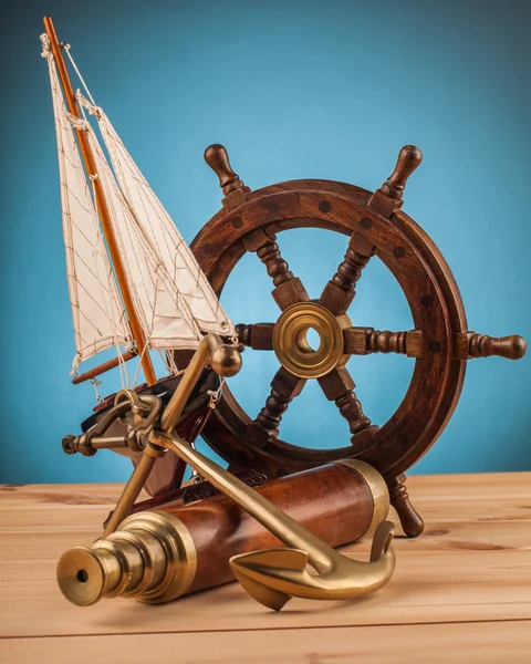 Old anchor and old telescope — Stock Photo, Image