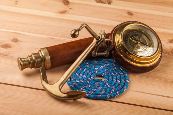 Old anchor and old telescope — Stock Photo, Image