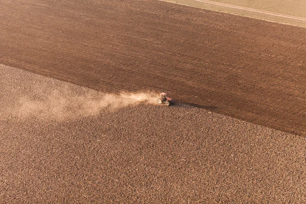 Aerial view of harvest fields with tractor — Stock Photo, Image