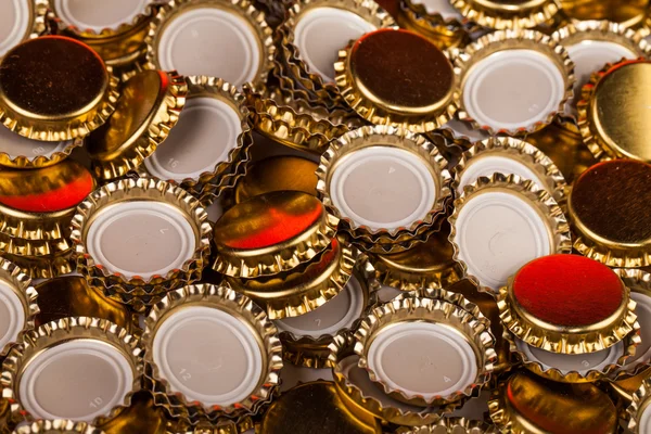 Tampas de garrafa dourada — Fotografia de Stock