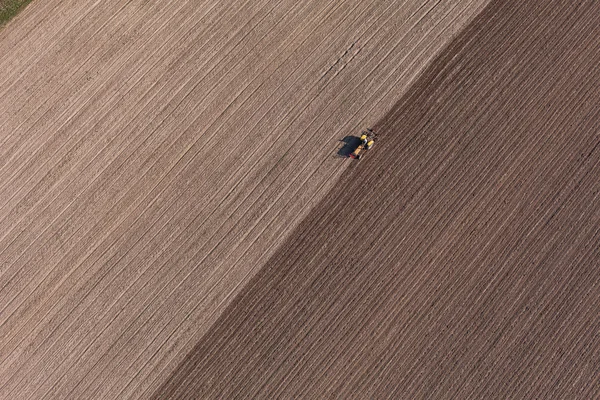 Harvest fields with tractor — Stock Photo, Image