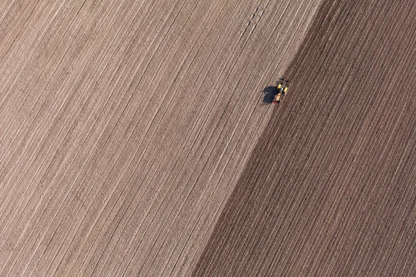 Aerial view of harvest fields with tractor — Stock Photo, Image