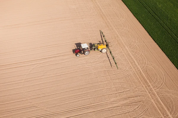 Aerial view of harvest fields with tractor — Stock Photo, Image