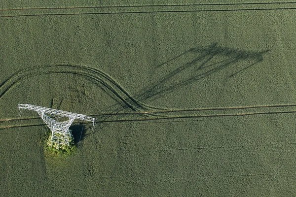 Aerial view of electrical wires large scale power energy tower — Stock Photo, Image