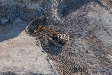 Aerial view of the working earth mover  clipart