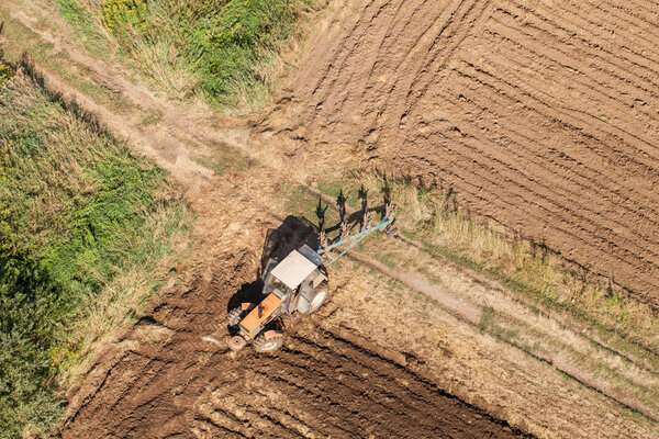 Harvest fields with tractor