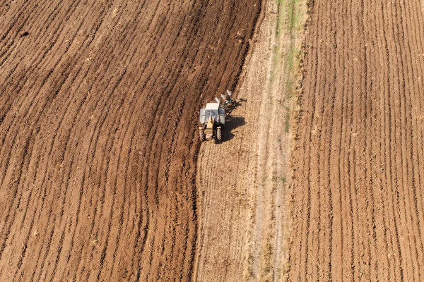 Harvest fields with tractor — Stock Photo, Image