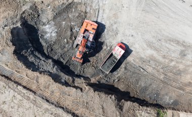 Aerial view of the earth mover in the quarry clipart