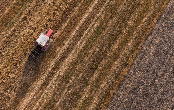 Aerial view of harvest fields with tractor — Stock Photo, Image