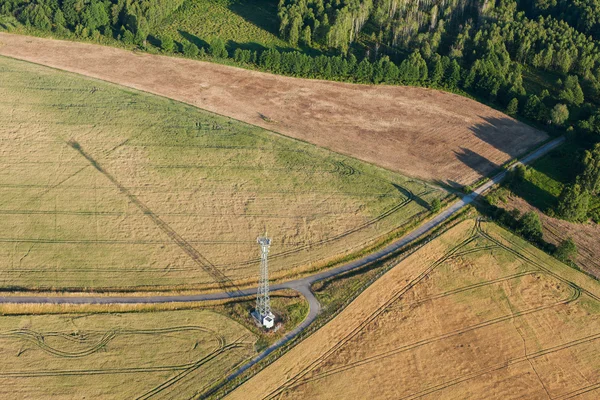 Aerial view of electrical wires in fields — Stock Photo, Image