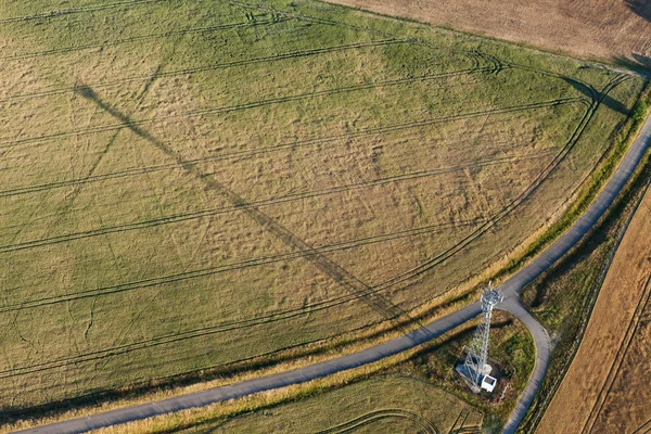 Aerial view of electrical wires in fields — Stock Photo, Image