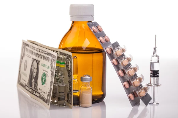 Medicines, two dollars and syringe — Stock Photo, Image