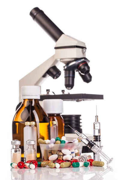 Medicines, microscope and syringes