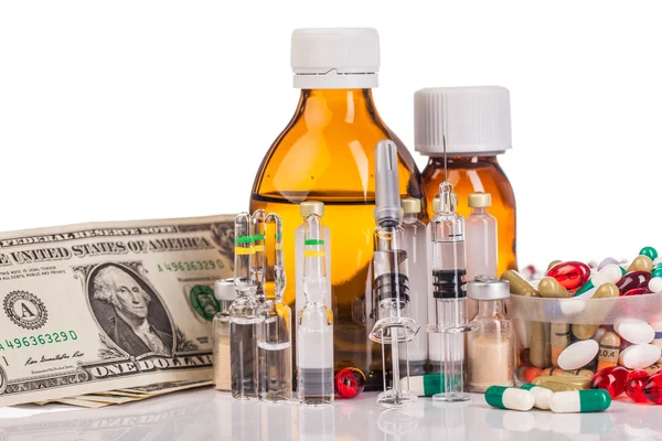 Variety medicines, dollars and syringes — Stock Photo, Image