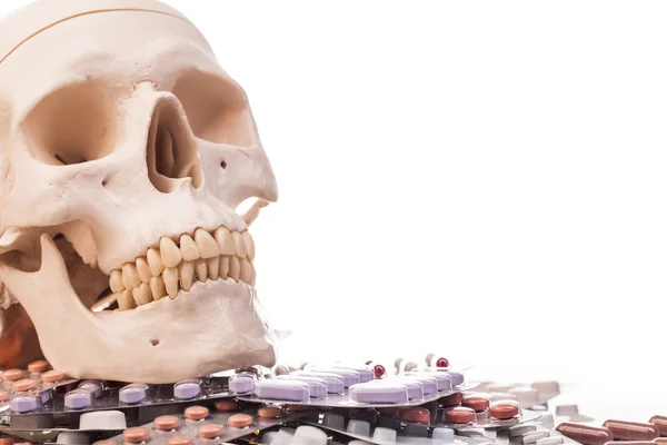 Variety medicines and human skull — Stock Photo, Image