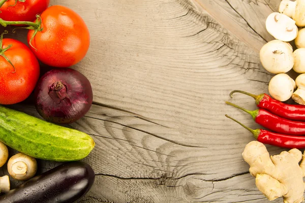 Ripe fresh vegetables on wooden background. The icon for healthy eating, diets, weight loss. — Stock Image Ripe fresh vegetables on wooden background. The icon for healthy eating, diets, weight loss. Stock Picture