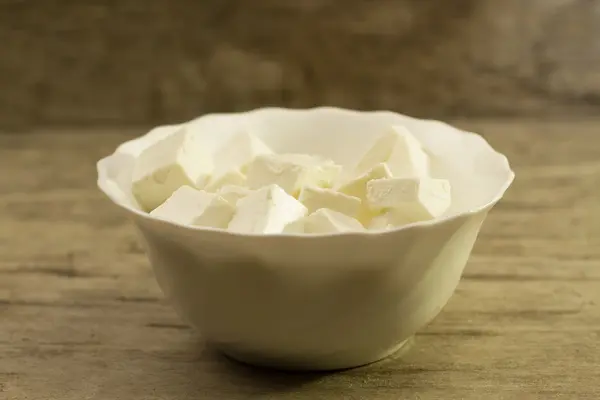 Feta is a traditional Greek cheese on wooden background — Stock Photo, Image