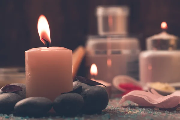 Spa composition with sea salt, candles, soap, shells, creams for face on wooden background. Aromatherapy. — 图库照片
