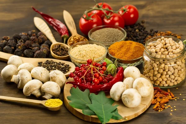 Wooden table with colorful spices, herbs and vegetables.  Asian cuisine — 스톡 사진