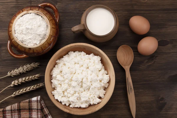 Fresh tasty curd in pot on wooden background. Homemade, cottage cheese — Stock Photo, Image