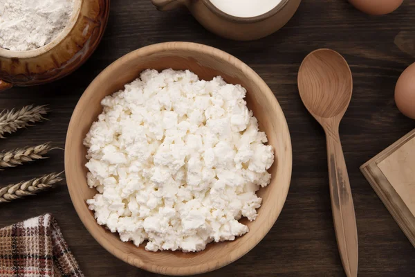 Fresh tasty curd in pot on wooden background. Homemade, cottage cheese — Stock Photo, Image