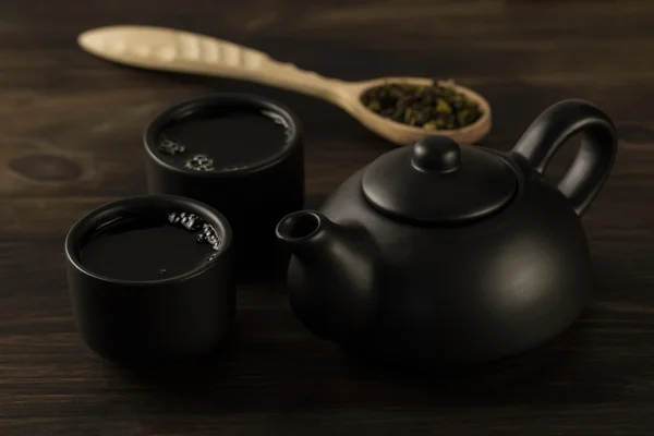 Black teapot, two cups on old wooden background . Menu, recipe — Stock Photo, Image