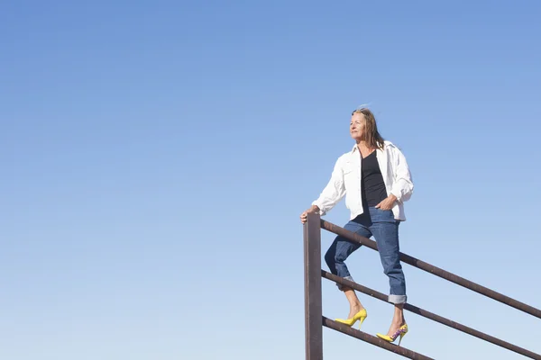 Confident senior woman on top outdoor — Stock Photo, Image