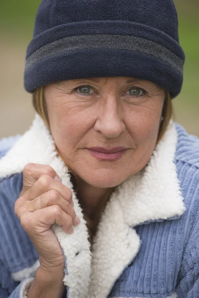 Woman in warm jacket and bonnet portrait — Stock Photo, Image