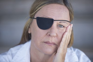 Tired woman with eye patch portrait clipart
