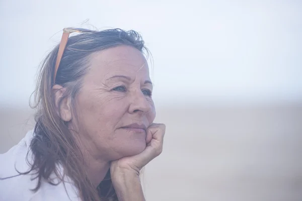 Thoughtful relaxed senior woman portrait outdoor — Stock Photo, Image