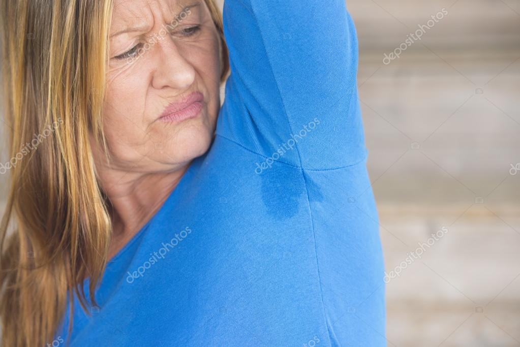 Woman sweating under arm angry — Stock Photo © roboriginal 71581757