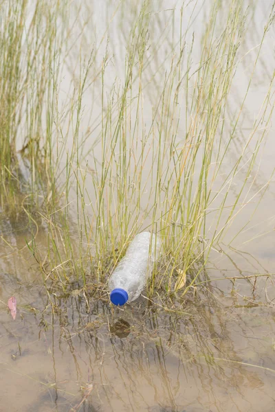 Plastic bottle garbage dumped in river water