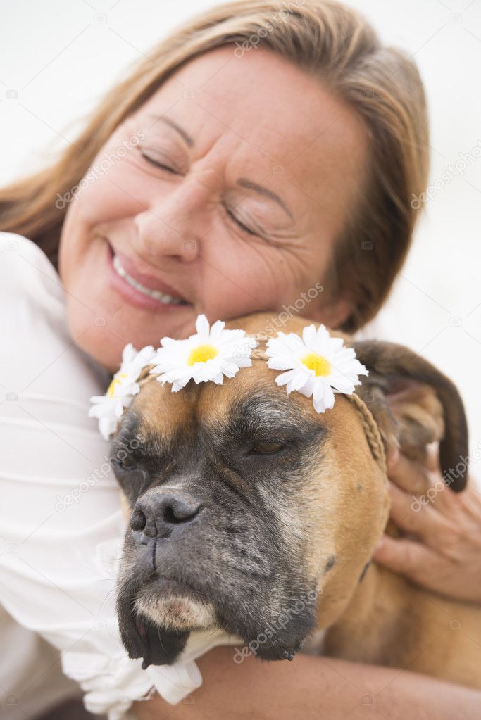 Woman in love with boxer pet dog