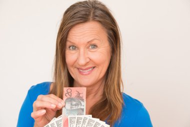 Joyful woman with us and australian dollar